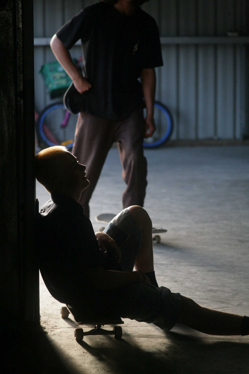 Skateboarder harsh lighting